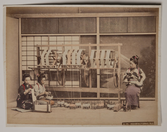 Manufacturing Silk, hand-colored Meiji albumen print: women re-reeling raw silk in the studio